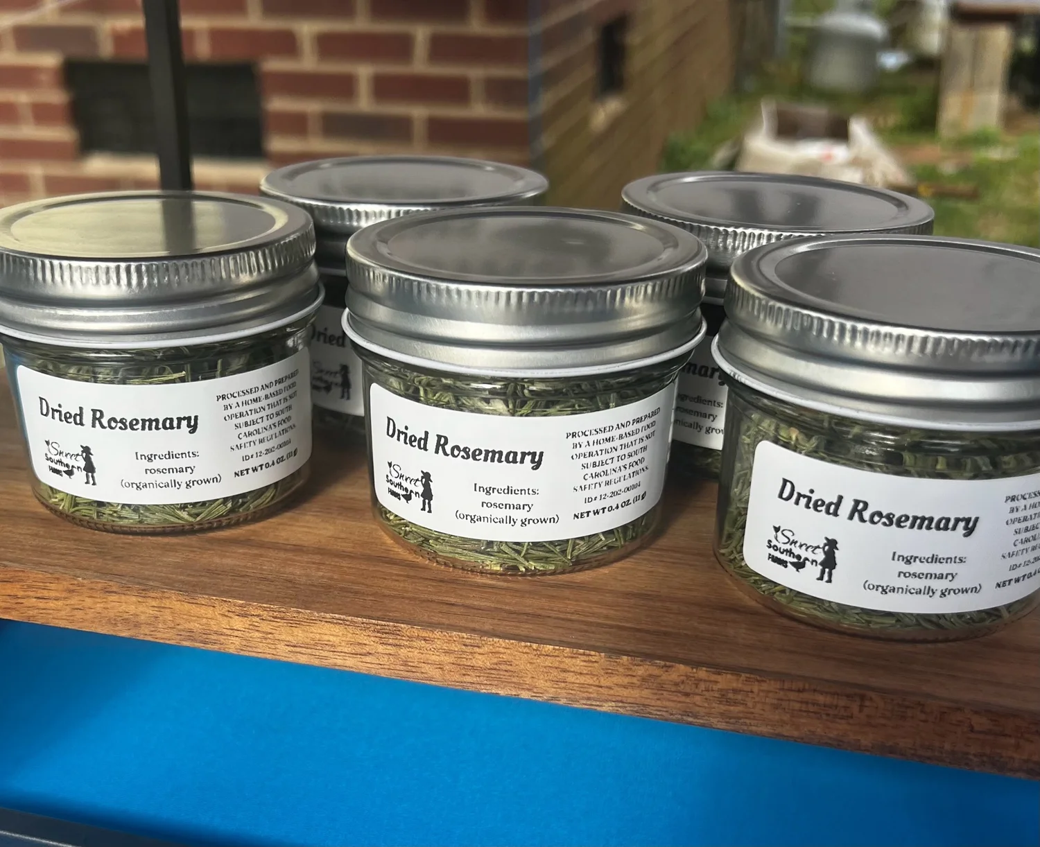 Jars of dried rosemary from the farm